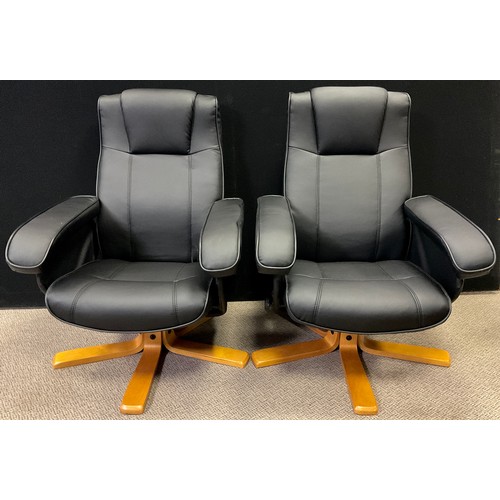 371 - A pair of Swivel and Recline contemporary armchairs, in black soft faux leather upholstery, bent ply... 