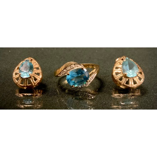 555 - A diamond and vibrant blue stone dress ring, 9ct gold shank, size O, 2.6g gross;  pair of oval earri... 