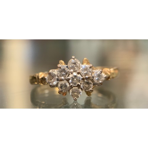 564 - A nine stone diamond cluster ring, total estimated diamond weight approx 0.40ct,  9ct gold shank, si... 