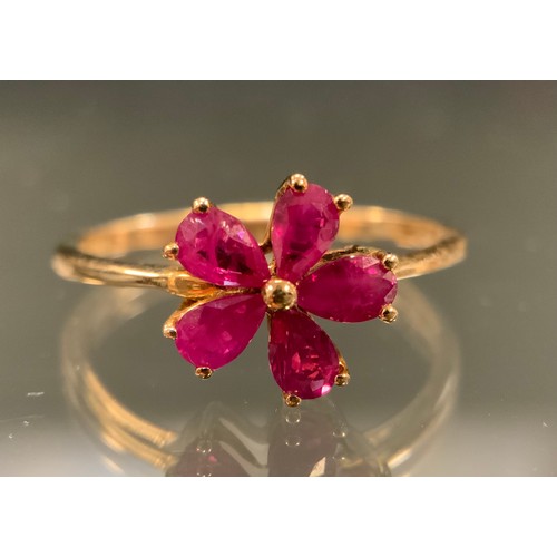 569 - A Myanmar, (Burmese) ruby five petal floral cluster ring, five pear shape pinky red rubies, total st... 