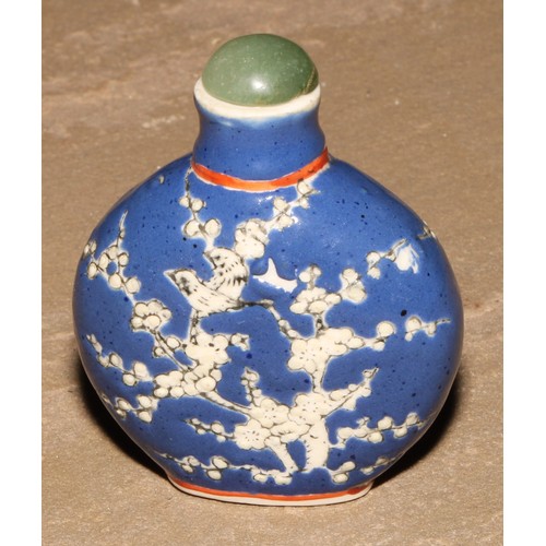 18 - A Chinese porcelain flatenned ovoid snuff bottle, moulkded and decorated in polychrome enamels with ... 
