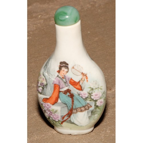 18 - A Chinese porcelain flatenned ovoid snuff bottle, moulkded and decorated in polychrome enamels with ... 