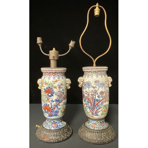 58 - A pair of early 19th century Chinese vases, converted to lamps, on carved wooden bases (vase bases a... 