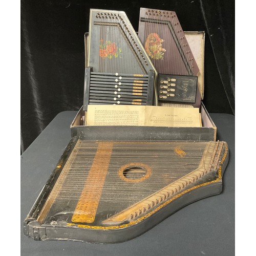 91 - A late 19th/early 20th century Reynolds Excelsior Harp, boxed; another similar; a 19th century zithe... 