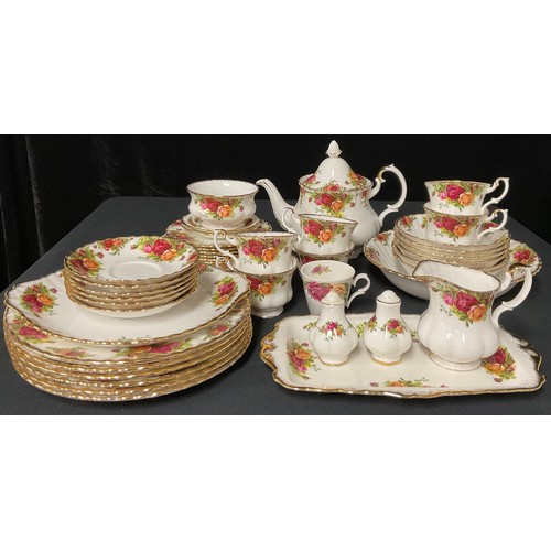 100 - A Royal Albert Old Country Roses pattern teapot, milk jug and sugar bowl, six teacups, saucers and t... 