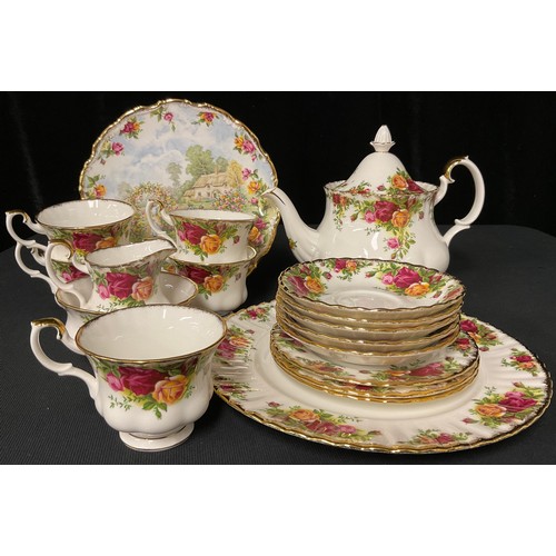 102 - A Royal Albert Old Country Roses pattern teapot, five teacups and saucers, three tea plates, milk an... 