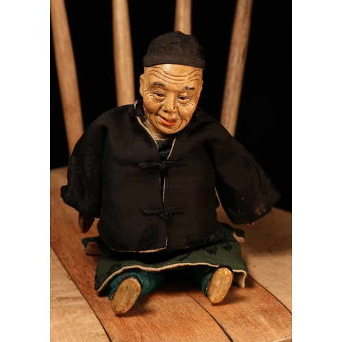 122 - An early 20th century Chinese Door of Hope Mission 'Uncle' doll, the painted papier-mâché head with ... 