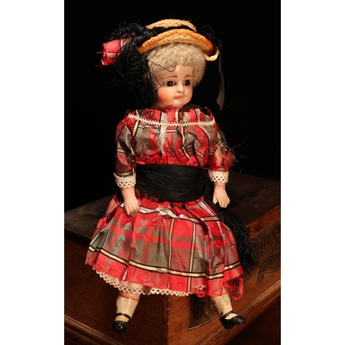 131 - A 19th century painted papier-mâché or composition shoulder head doll, the papier-mâché or compositi... 