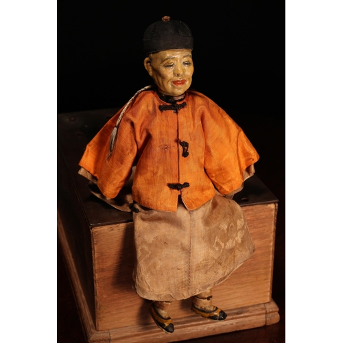 143 - An early 20th century Chinese Door of Hope Mission 'Father' doll, the painted papier-mâché head with... 