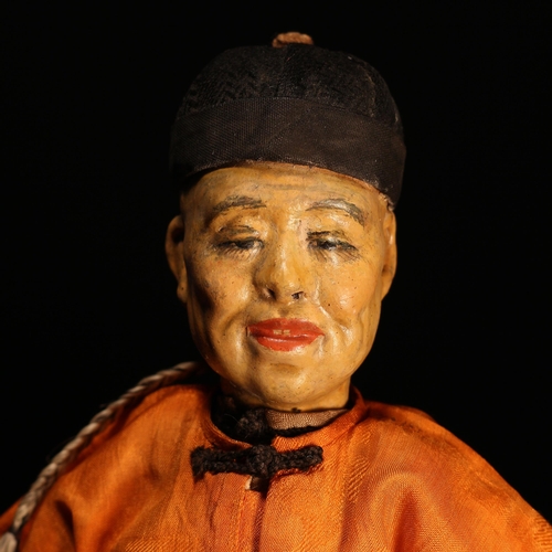 143 - An early 20th century Chinese Door of Hope Mission 'Father' doll, the painted papier-mâché head with... 