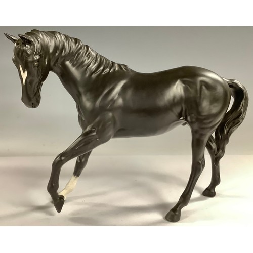 593 - A Beswick horse model, Black Beauty, with white blaze and sock, matt glaze, 18cm