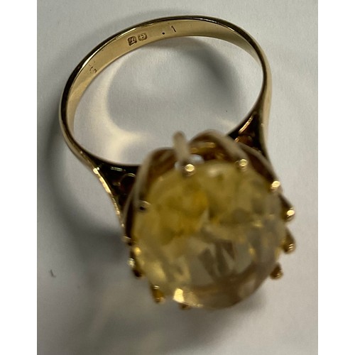 617 - A 9ct gold and citrine ring; a 9ct gold and amethyst seal (2)