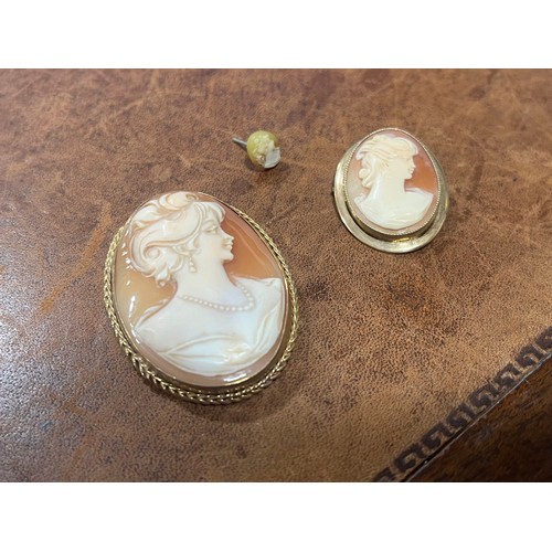 634 - A Victorian 9ct gold shell cameo brooch, carved with a classical beauty, 4.2cm high; another smaller... 