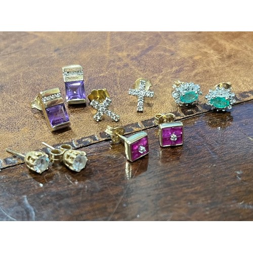 641 - A pair of 9ct gold, amethyst and diamond rectangular ear studs; a pair of 9ct gold and diamond cruci... 