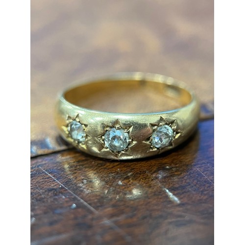 648 - An 18ct gold and diamond three stone ring, gypsy set, 0.35ct estimated carat weight, size P/Q, 4.45g... 