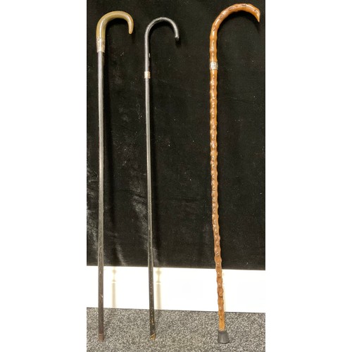 657 - Three silver mounted walking sticks