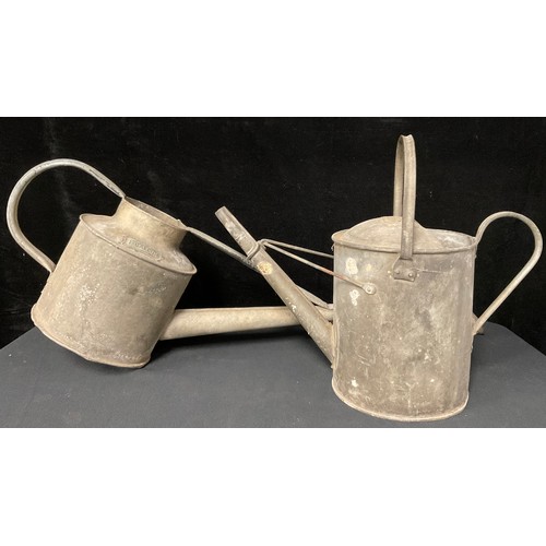 699 - A galvanized one gallon watering can; another similar (2)