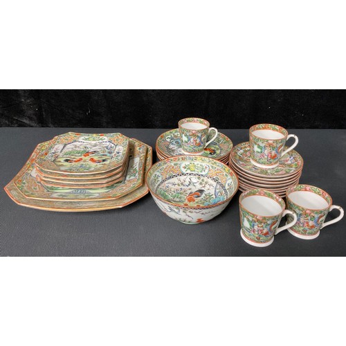 709 - A Chinese porcelain part tea service comprising plates, cups, etc