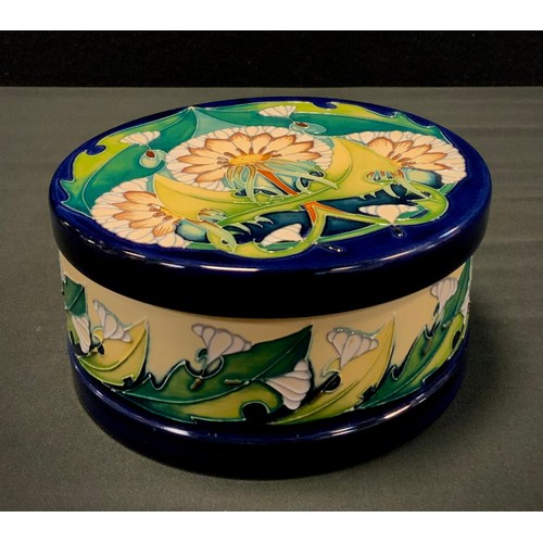 7 - A Moorcroft pottery circular lidded box, decorated in the Art Nouveau style Seeds pattern with bloss... 