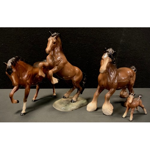 17 - Beswick horses including Brown glazed foal, Cantering Shire horse, model 975; others (4)