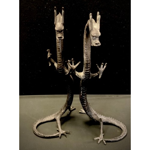 49 - A pair of bronzed metal dragons, rearing, 41cm high