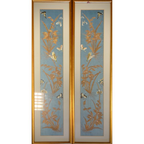 54 - A pair of Japanese embroidered panels, each with a grasshopper and butterflies amongst branches, pal... 
