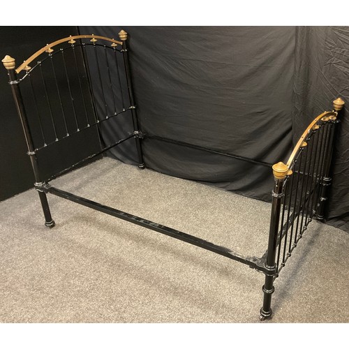 56 - A Victorian cast iron and brass small double bed frame, 150cm high x 200cm wide x 120cm deep.