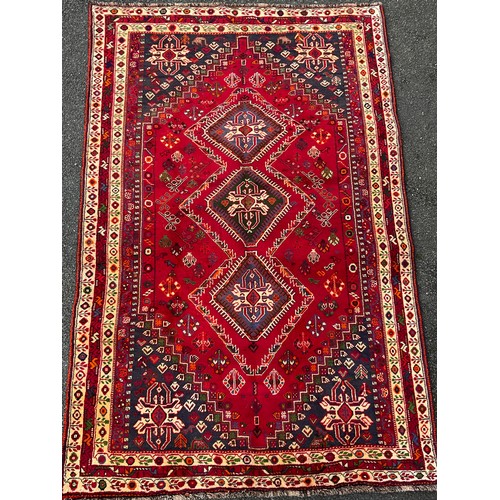 57 - A South West Persian Qashga’i rug / carpet, knotted with traditional stylised figures and abstract m... 