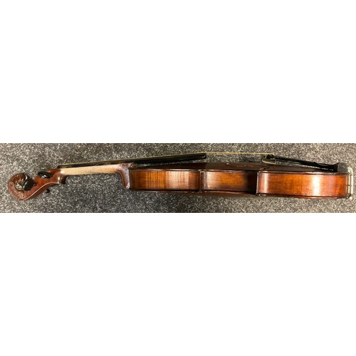 66 - A full size violin, the peg-box scroll carved as the head of a lion, in the style of Jacobus Stainer... 