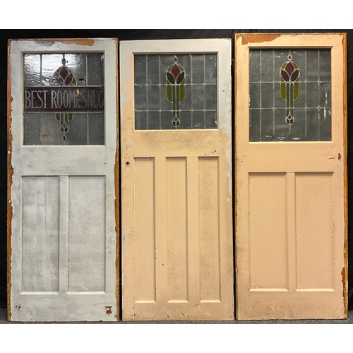 86 - Architectural salvage - three early 20th century doors with stained glass panels, formerly from The ... 