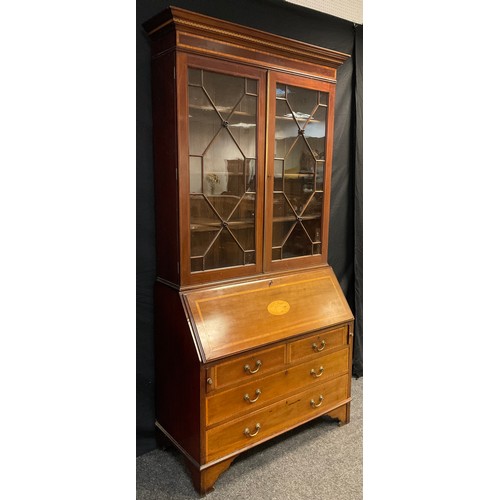 89 - An Edwardian inlaid mahogany bureau bookcase, out swept cornice with inlaid Greek-key decoration, ab... 