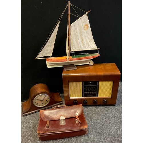 90 - A model pond yacht, single mast and sail, wooden hull painted red and white, 55cm high, 62cm long;  ... 