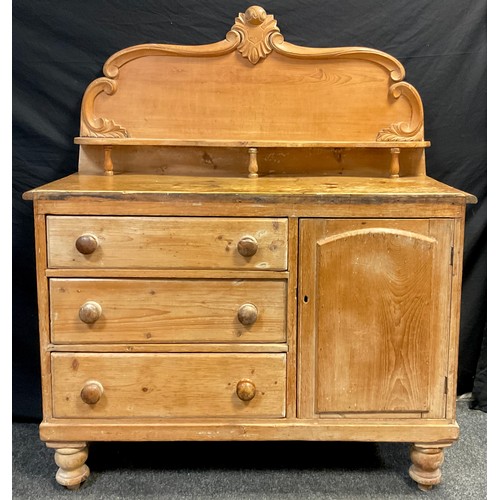 91 - A Victorian pine Lincolnshire dresser, high quarter-galleried back, with carved c-scroll border, and... 