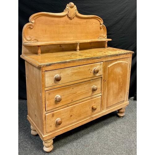 91 - A Victorian pine Lincolnshire dresser, high quarter-galleried back, with carved c-scroll border, and... 