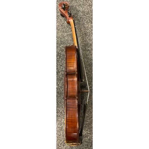 94 - Musical instruments - an early 20th century full size violin, with soft case, and bow;  a BM classic... 