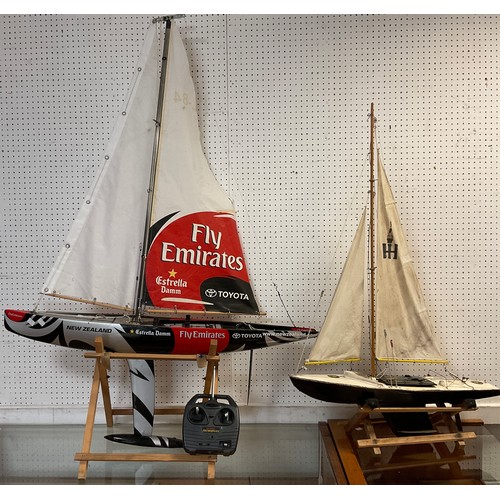 95 - A Fly Emirates racing pond yacht, composite hull, single mast, in black, grey and red, fitted with F... 