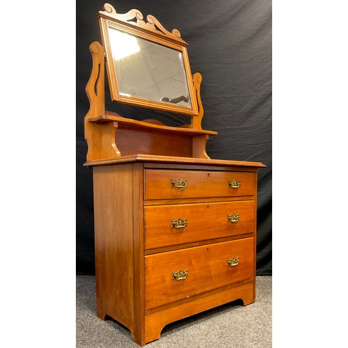 105 - An early 20th century mahogany dressing chest, rectangular bevelled plate over single shelf, and thr... 