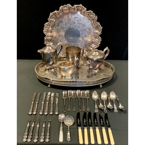 110 - A silver plated salver, oval tray,  three piece tea set,  white metal hafted flatware etc