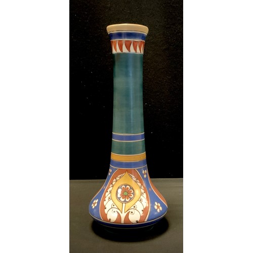 126 - A Dutch gouda elongated ovoid vase, decorated with flowers and patterns, stamped Lindus Holland.