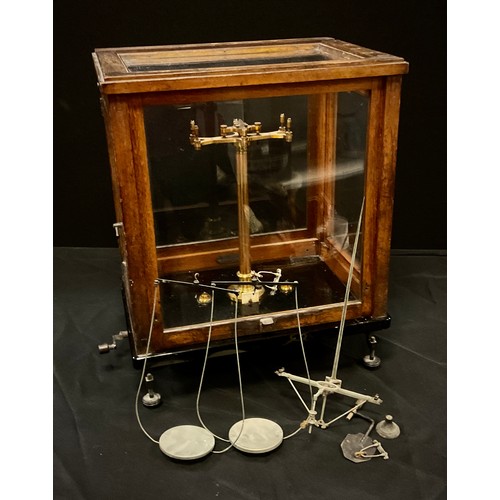 137 - A pharmaceutical balance scale, cased,45cm x 37cm x 27cm.