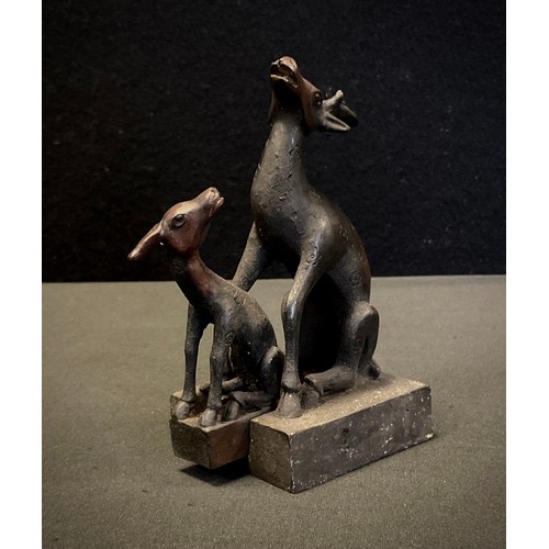 163 - A Chinese patinated bronze desk seal, in the form of 2 interlocking deer, height 11.5cm