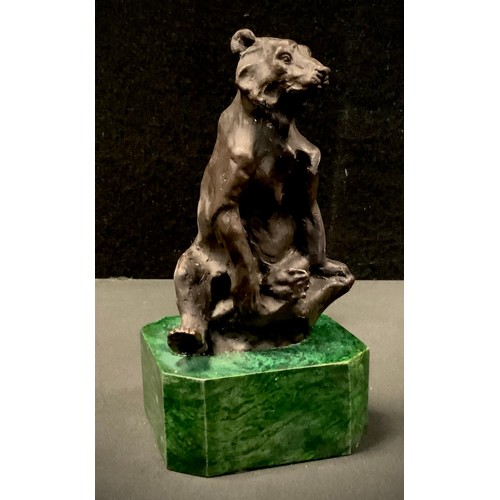 168 - A Bronzed metal figure, seated Bear, malachite effect plinth, 16cm high.