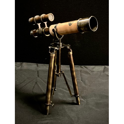 173 - A reproduction miniature Kelvin & Hughes monocular telescope on tripod stand, 26cm long.