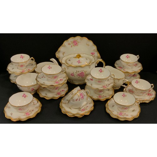 217 - A Royal Crown Derby Pinxton Roses pattern tea set, for twelve inc teapot, bread/cake plate, cups, sa... 