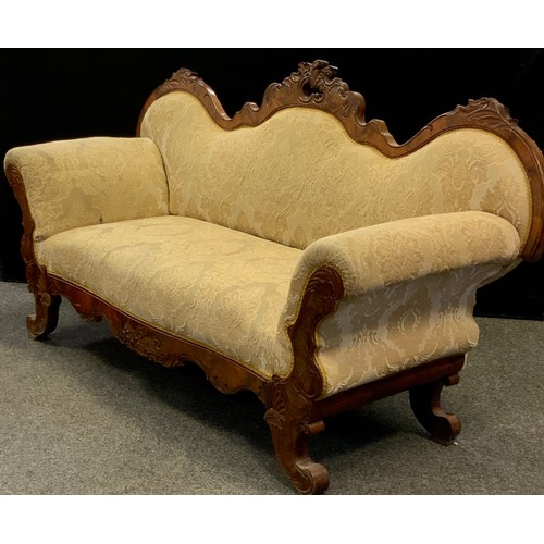 247 - A Victorian Louis XV revival walnut sofa, serpentine-shaped back, rococo carved c-scrolls and leaves... 