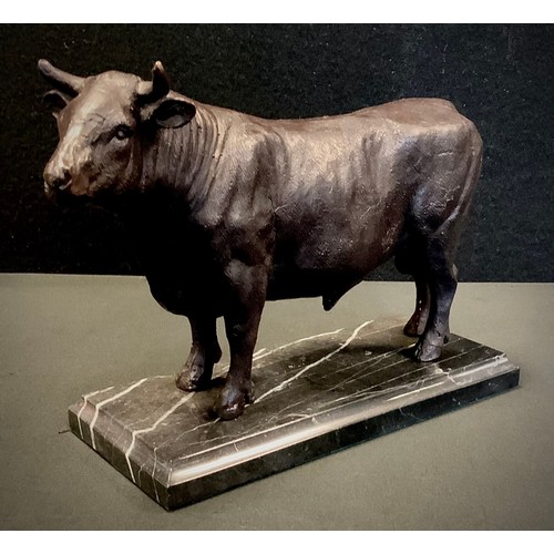 293 - A bronzed metal animalier model as a Bull. black marble plinth base, 17cm high, 24.5cm long.