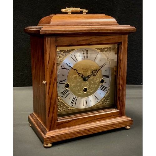 301 - A Franz Hermle 8-day mantel clock, oak case, chiming movement.