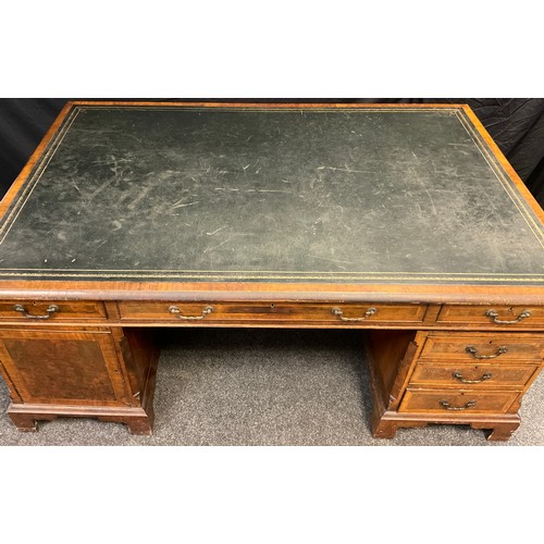 306 - A George III style mahogany and walnut veneered partner’s desk, dark green faux leather writing surf... 