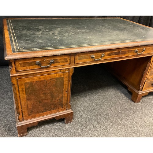 306 - A George III style mahogany and walnut veneered partner’s desk, dark green faux leather writing surf... 