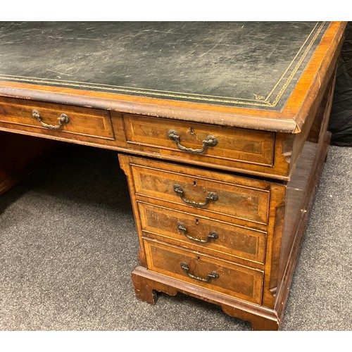 306 - A George III style mahogany and walnut veneered partner’s desk, dark green faux leather writing surf... 